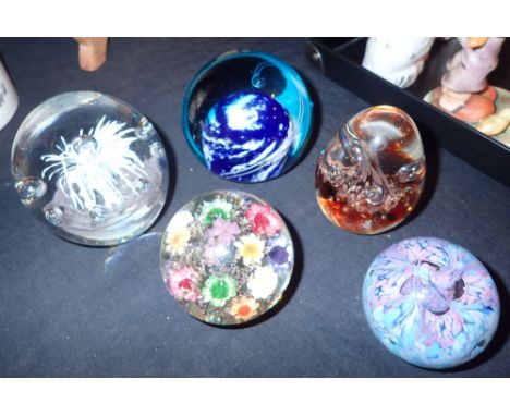Five paperweights including a limited edition Caithness example