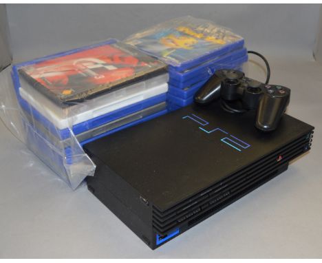 POLICE> A boxed PS2 console and games [VAT ON HAMMER PRICE] [NO RESERVE]