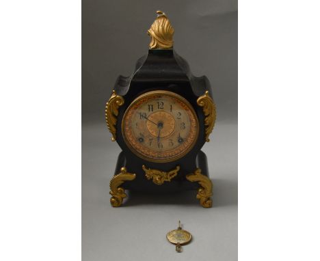 A metal cased ornate chiming mantle clock. Movement marked “Ansonia Clock USA New York”. With pendulum. 35cm tall.