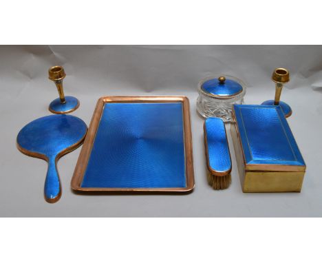A copper and guilloche enamel vanity set comprising a tray, mirror, pair of candlesticks, brush, box and jar (7)