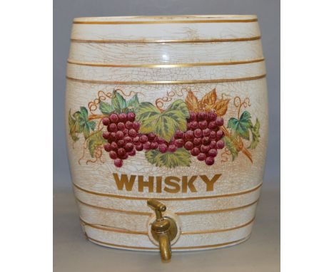 A large ceramic Whiskey barrel decanter with brass faucet. 37cm tall.