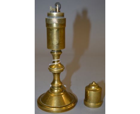 An interesting brass table lighter in the form of a candlestick. 20cm tall. 