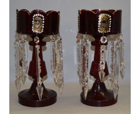 A pair of late 19th/ early 20th century ruby glass gilt lustres. 8 drops each. 30cm tall.