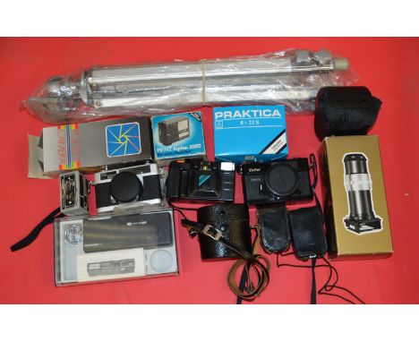 A selection of cameras and light meters together with a camera tripod and a large quantity of lenses including a Pentamax (M 