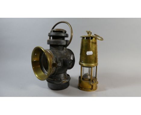 A Brass Miners Lamp by the Protector Lamp and Lighting Co. Together with a Brass Mounted Converted Lamp by Griffith and Sons,