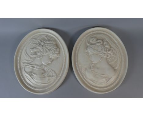 A Pair of Ceramic Ovals Decorated in Relief with Maidens, 27cm High 