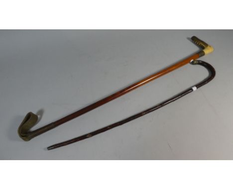 A Horn Handled Riding Crop and a Child's Walking Stick