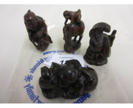 Four various carved wooden netsuke