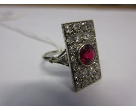 Art Deco 18ct white gold rectangular ring set with a circular ruby and twenty eight diamonds