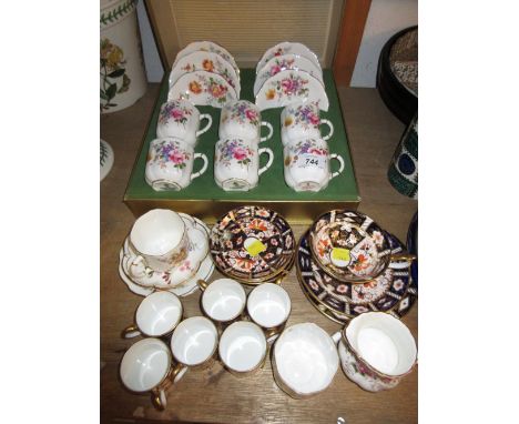 Box set of six Royal Crown Derby floral decorated coffee cans with saucers, together with a set of six similar Imari pattern 