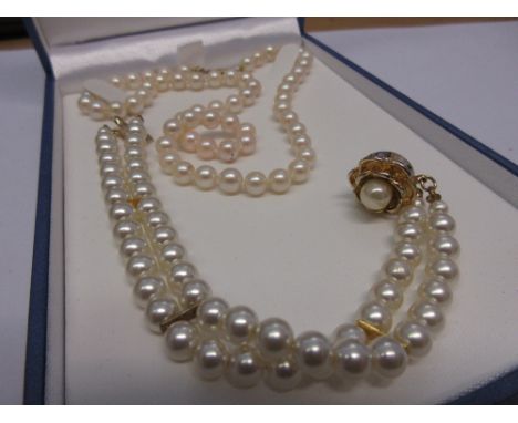 Uniform cultured pearl necklace with a 9ct gold clasp together with a simulated pearl two string bracelet