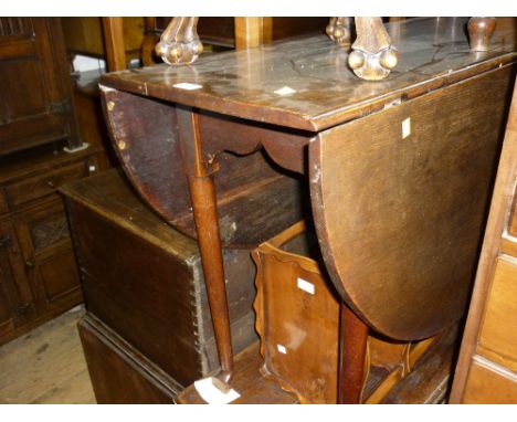 18th Century oak oval drop-leaf dining table on tapering supports with pad feet, together with a set of four late 19th or ear