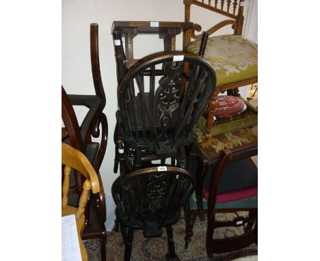 Set of four wheel and stick back kitchen chairs on turned supports together with a small oak stool