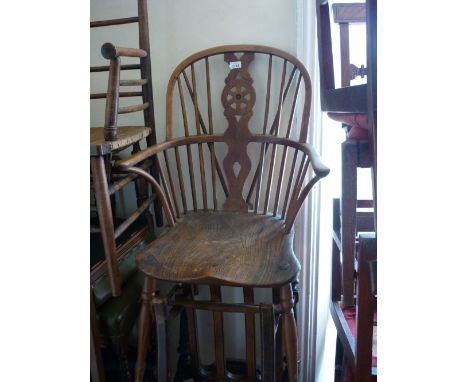 19th Century yew wood and elm seated stick back Windsor armchair on turned supports together with a child's high chair on tur