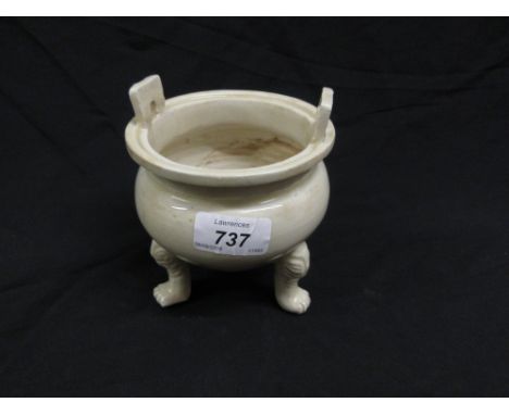 Chinese light glazed porcelain two handled censer on three supports, 4.5ins diameter, 5.5ins high