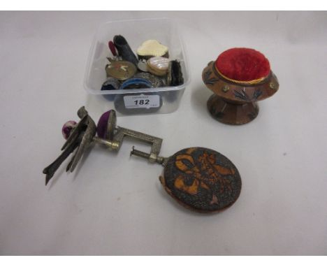 Collection of various pincushions including a bird table clamp cushion