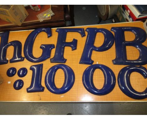 Box containing a quantity of various blue vitrous enamel metal letters spelling ' G.B. Food and Hi '
