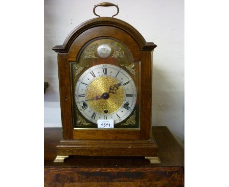 Reproduction mahogany cased bracket clock having brass dial with silvered chapter ring having Roman numerals and three train 