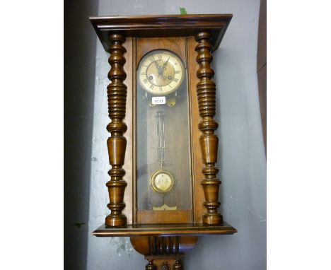 Vienna style walnut two train wall clock together with an oak dome shaped mantel clock