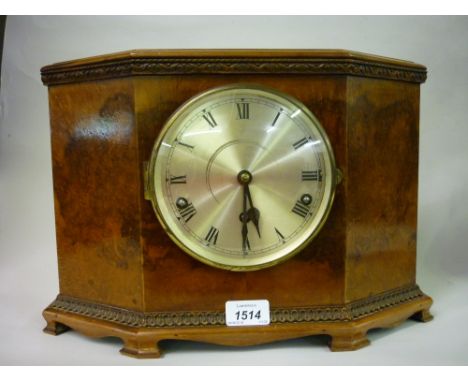 Art Deco walnut mantel clock, the silvered dial with Roman numerals with a three train Westminster chime movement