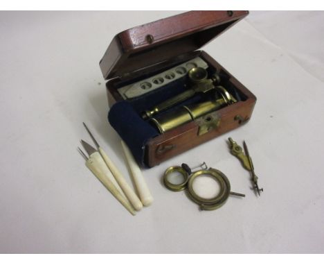 19th Century mahogany cased miniature travel or field microscope with ivory slides and later tools