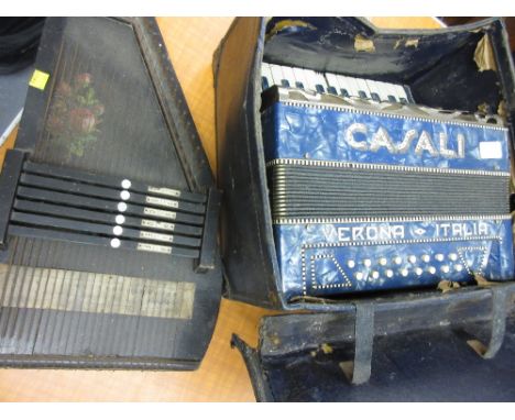Casali sixteen button piano accordion in case, together with a zither