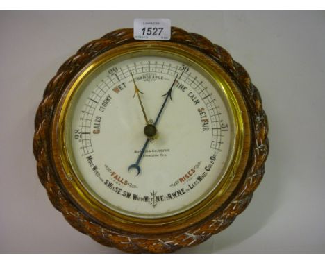 Circular oak cased aneroid barometer