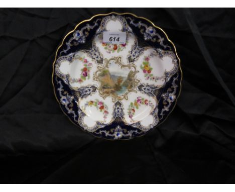 19th Century Royal Worcester circular cabinet plate, painted with a river landscape and panels of flowers with a blue border