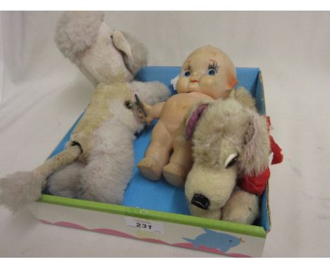 Mid 20th Century clockwork toy dog together with an early Merrythought toy dog and a Kewpie doll