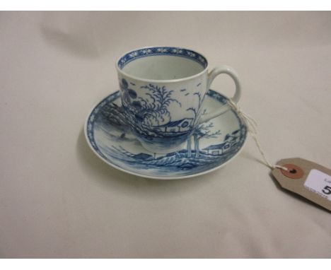 18th Century Worcester / Caughley cup and saucer decorated in blue with river landscapes