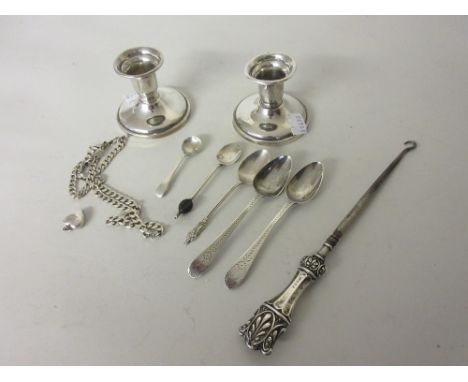 Pair of Birks sterling silver dwarf candlesticks, five various spoons, silver handled button hook, silver chain and a locket