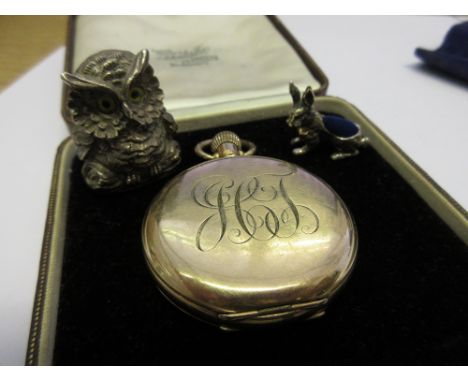 Gold plated open face pocket watch, silver figure of an owl and a reproduction silver pin cushion in the form of a hare