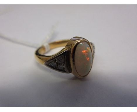 Oval opal and diamond set dress ring