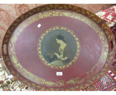 19th Century oval red toleware tray painted with a portrait of a seated lady