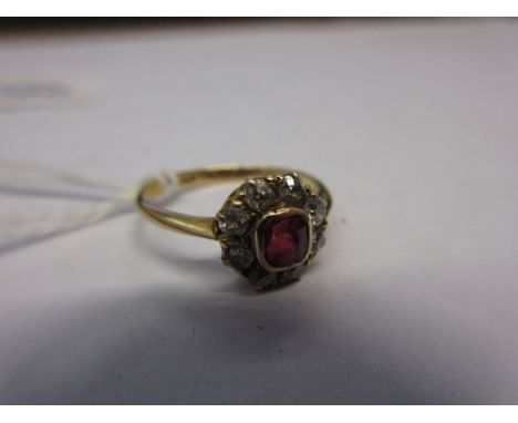 Small 18ct gold ruby and diamond set cluster ring