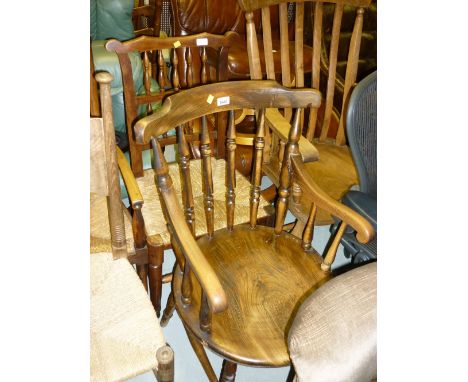 19th Century elm and beech stick back elbow chair with circular seat on turned supports together with an 18th Century spindle