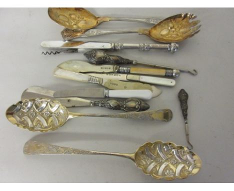 Two Georgian silver gilt berry spoons, silver handled shoe horn, small silver handled button hook, a silver bladed knife insc