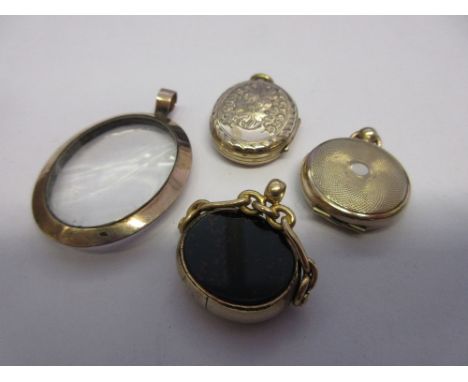 Two 9ct gold back and front lockets, a 9ct gold fob and a portrait locket