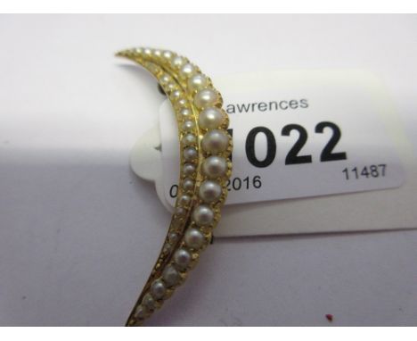 Victorian yellow metal and split pearl set crescent brooch