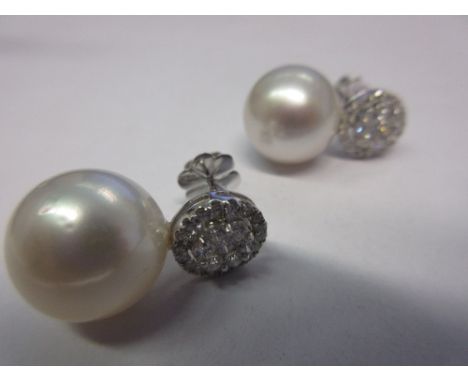 Pair of large natural South Sea pearl and diamond earrings, the diamonds approximately 1ct