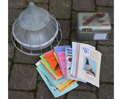 STB pigeon racing clock, metal bird feeder and assorted pigeon racing books (one signed)