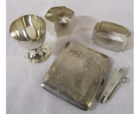 Silver cigarette case Birmingham 1939 2.24 ozt, egg cup London 1966 1.38 ozt &amp; 2 napkin rings Birmingham 1939 and one ind