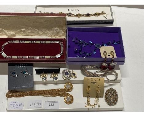 A shelf of assorted costume jewellery including Monet, Sarah Cov.gv 