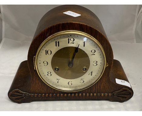 A vintage 1930's mahogany cased mantle clock with key and pendulum, shipping unavailable 