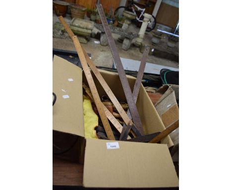 A box of vintage tools, rules etc