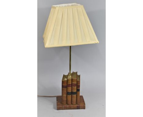 A Novelty Table Lamp in the Form of Leather Bound Books, 64cms High 