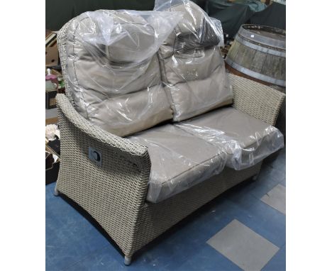 A Hartland Patio Rattan Two Seater Sofa, Cushions Still in Plastic Cover However Rattan Frame with Some Damage 
