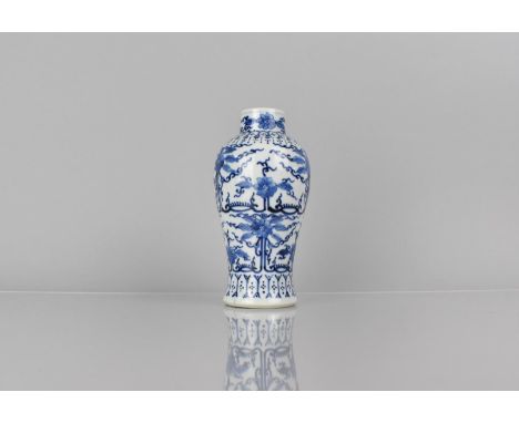 A 19th/20th Century Blue and White Porcelain Vase of Baluster Form decorated in a Floral and Scrolled Motif, 17.5cms High, Fo