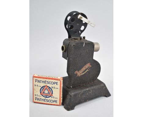 A Vintage Hand Operated Tin Plate Bingoscope Projector together with a Pathescope 9.5mm Film, "Mickey's Red Skin Round Up" 