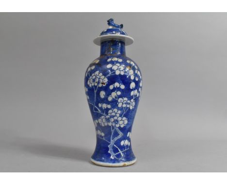 A 19th Century Chinese Prunus Pattern Baluster Vase and Cover, Four Character Mark to Base for Kangxi, 27cm high, Condition I